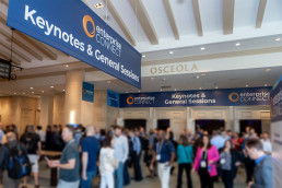 Keynote directional banner design showcasing the refreshed InformaTech brand identity